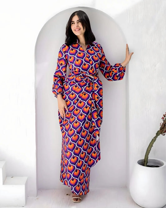 Woman wearing a bold geometric print crepe fabric maxi dress in vibrant colors.