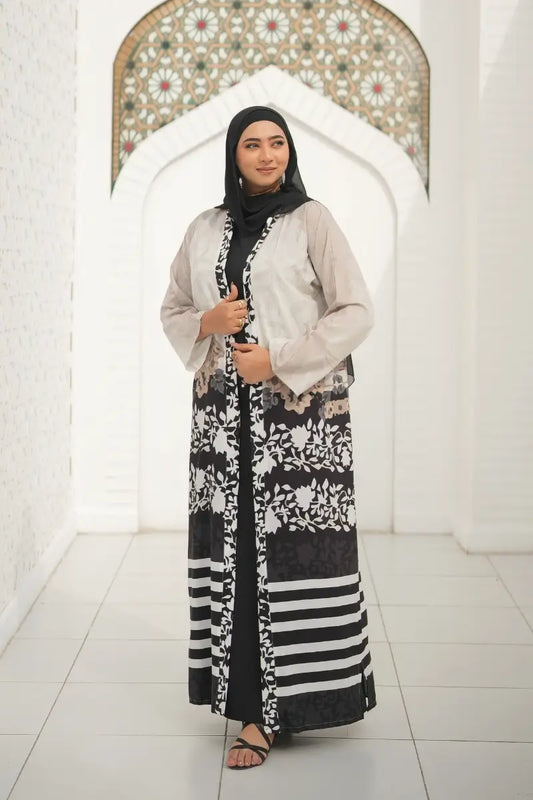 Front view of the Black and White Floral Abaya, featuring a flowing silhouette and intricate floral print, perfect for Eid or weddings.