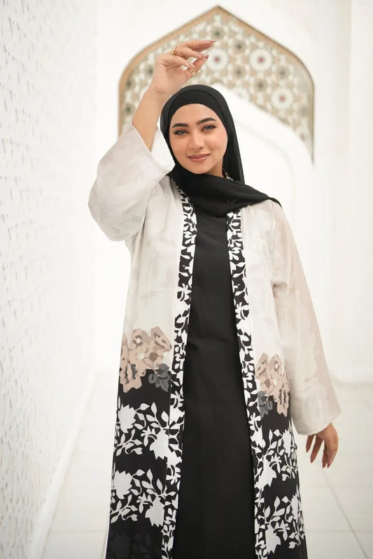 Close-up of the luxurious silk and cotton fabric in the Black and White Floral Printed Abaya, highlighting its soft texture and floral pattern.