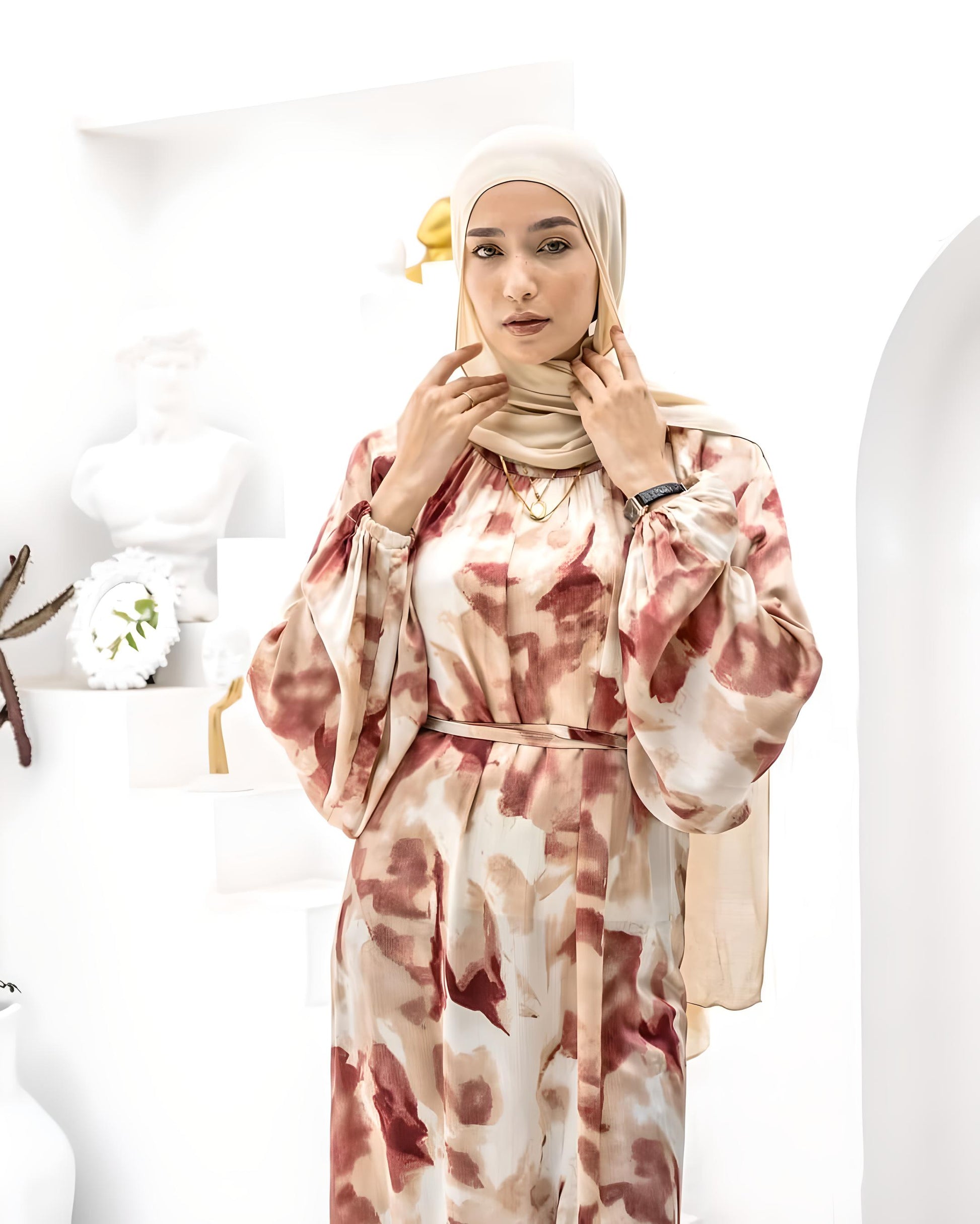 Modern modest outfit featuring a floral print dress and beige hijab.