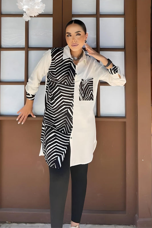 Front view of a black and white button-up blouse with a geometric print, crafted from rayon slub fabric.