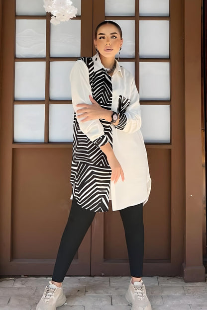 Detailed view of the geometric pattern on a black and white blouse in rayon slub fabric.