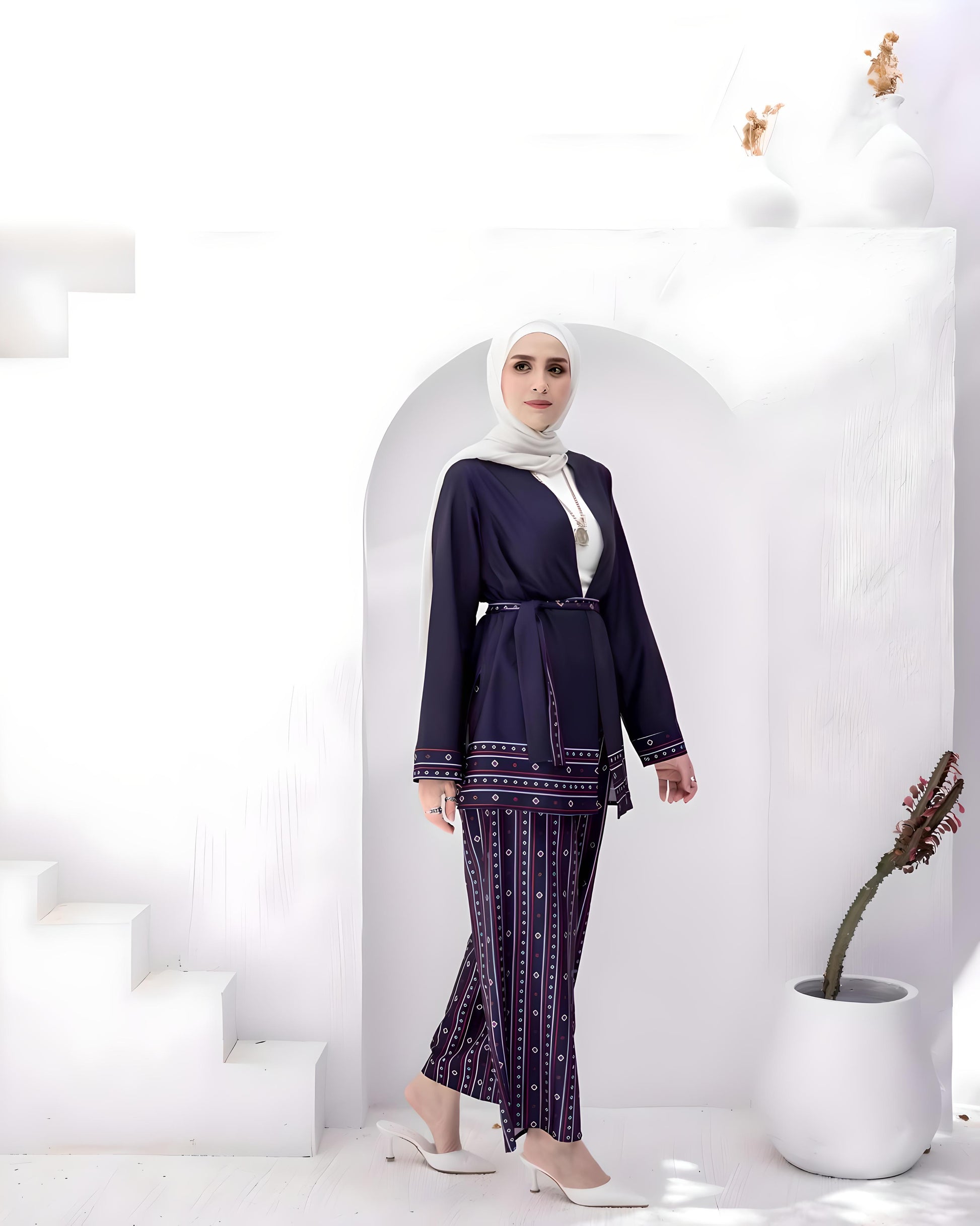 Elegant navy blue soft crepe fabric suit with a matching belt and white hijab.