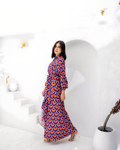 Stylish woman posing in a vibrant geometric print dress with matching belt.