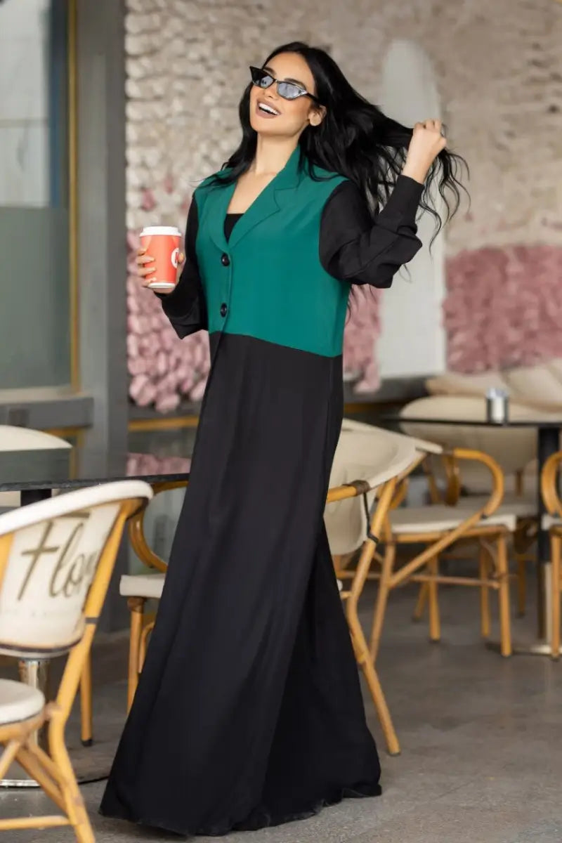 Chic two-tone abaya made from SPH fabric with a green blazer-style bodice and black flowing skirt, open design.